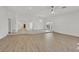 Expansive living room with hardwood floors, chandelier, and easy access to other rooms in the house at 1901 Calle De Espana, Las Vegas, NV 89102