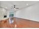 Bright living room boasting hardwood floors, fan, and stone fireplace at 1901 Calle De Espana, Las Vegas, NV 89102