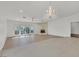 Bright living room with stone fireplace, chandelier, and sliding doors at 1901 Calle De Espana, Las Vegas, NV 89102