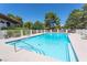 A community pool area offering a refreshing escape, surrounded by mature trees and seating areas at 1901 Calle De Espana, Las Vegas, NV 89102