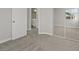 View of bedroom leading to a bathroom and mirrored closet at 1909 Falling Tree Ave, North Las Vegas, NV 89031