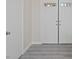 Entryway featuring double doors, wood-look flooring and neutral paint at 1909 Falling Tree Ave, North Las Vegas, NV 89031