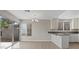 Modern kitchen view featuring bright kitchen with adjacent dining area and outdoor access at 1909 Falling Tree Ave, North Las Vegas, NV 89031