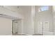 Open-concept room with soaring ceilings and plenty of natural light through various windows at 1909 Falling Tree Ave, North Las Vegas, NV 89031