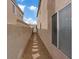 A side yard is accessible via a stone pathway at 1909 Falling Tree Ave, North Las Vegas, NV 89031