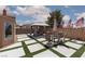 Spacious backyard featuring a gazebo, outdoor seating, and manicured landscaping, perfect for outdoor entertaining at 1911 Venalynne St, Las Vegas, NV 89156