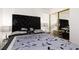 Bedroom with elegant decor featuring a plush headboard and mirrored closet at 1911 Venalynne St, Las Vegas, NV 89156