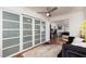 Cozy bedroom with modern closets, hardwood floors, and a comfortable sitting area at 1911 Venalynne St, Las Vegas, NV 89156