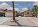 Charming single-story home with well-maintained landscaping, complemented by mature trees at 1911 Venalynne St, Las Vegas, NV 89156