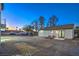 This spacious backyard offers ample parking plus a patio with seating at 210 E Longacres Dr, Henderson, NV 89015