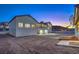 The backyard features ample space and potential for creating a private oasis at 210 E Longacres Dr, Henderson, NV 89015