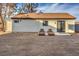 An outdoor space featuring two lounge chairs on a gravel base, perfect for relaxation at 210 E Longacres Dr, Henderson, NV 89015