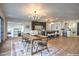 Modern dining area with stylish lighting and open kitchen access at 210 E Longacres Dr, Henderson, NV 89015