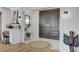 Elegant entryway with unique tile flooring, a work area, and striking double doors at 210 E Longacres Dr, Henderson, NV 89015