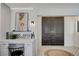 Stylish foyer area with decorative mosaic tile, a desk, and sleek lighting fixtures at 210 E Longacres Dr, Henderson, NV 89015
