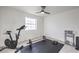Exercise room equipped with modern cycling equipment and free weights on a black floor mat at 210 E Longacres Dr, Henderson, NV 89015
