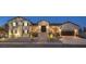 Stunning two-story home with a welcoming entrance and well-maintained landscaping at 210 E Longacres Dr, Henderson, NV 89015