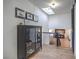 Upstairs hallway with natural light from skylight at 210 E Longacres Dr, Henderson, NV 89015