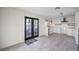 Bright kitchen with white cabinets, black accents, and views from the French doors at 210 E Longacres Dr, Henderson, NV 89015