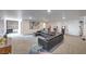 Large living room featuring a leather couch, recessed lighting, and a view of the hallway at 210 E Longacres Dr, Henderson, NV 89015