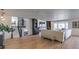 Bright and open living room with hardwood floors and staircase at 210 E Longacres Dr, Henderson, NV 89015