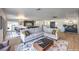 Open concept living area featuring a plush sofa and natural light at 210 E Longacres Dr, Henderson, NV 89015