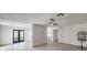 Open concept living space featuring French doors, tile flooring, and neutral walls at 210 E Longacres Dr, Henderson, NV 89015