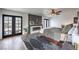Main bedroom featuring an elegant fireplace and natural light at 210 E Longacres Dr, Henderson, NV 89015