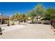 Spacious backyard with mature trees, a covered patio, and plenty of room for entertaining at 2255 S Buffalo Dr, Las Vegas, NV 89117