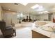 Bright bathroom features a large mirror, soaking tub, walk-in shower, and vanity with sink and storage at 2255 S Buffalo Dr, Las Vegas, NV 89117