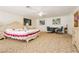Bedroom featuring a large bed, ceiling fan, and a seating area at 2255 S Buffalo Dr, Las Vegas, NV 89117