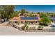 Beautiful single-story home featuring a red tile roof, solar panels, and professionally landscaped front yard at 2255 S Buffalo Dr, Las Vegas, NV 89117