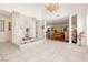 Grand foyer with tiled floors, a decorative fountain, and elegant columns leading into the living spaces at 2255 S Buffalo Dr, Las Vegas, NV 89117