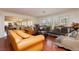 Elegant living room featuring hardwood floors, large windows, and luxurious furniture at 2255 S Buffalo Dr, Las Vegas, NV 89117