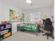 Colorful bedroom with vibrant decor, a comfortable bed, and a playful atmosphere at 2885 Timber Country Rd, North Las Vegas, NV 89086