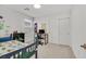 Bright bedroom featuring neutral carpeting, a study desk, and natural light at 2885 Timber Country Rd, North Las Vegas, NV 89086