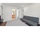 Spare bedroom featuring a comfortable grey futon and ensuite bathroom and closet at 2885 Timber Country Rd, North Las Vegas, NV 89086