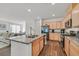 Bright kitchen featuring granite countertops, stainless steel appliances, and open layout at 2885 Timber Country Rd, North Las Vegas, NV 89086