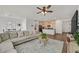 Bright living space showcasing an open floor plan and modern hardwood floors at 2885 Timber Country Rd, North Las Vegas, NV 89086