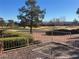 Enjoy golf course views from this lovely backyard sitting area with gravel landscaping and mature trees at 3004 Darby Falls Dr, Las Vegas, NV 89134