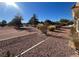 Nice backyard with desert landscaping, mature trees and golf course views at 3004 Darby Falls Dr, Las Vegas, NV 89134