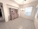 Traditional dining room with decorative chandelier and large window for natural light at 3004 Darby Falls Dr, Las Vegas, NV 89134