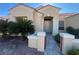 Beautiful home with desert landscaping, flagstone walkway, red tile roof, and covered front entry at 3004 Darby Falls Dr, Las Vegas, NV 89134