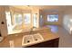 Open kitchen with granite countertops overlooking the dining and living areas at 3004 Darby Falls Dr, Las Vegas, NV 89134