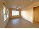 Bright living space with tile floors, ceiling fan and large windows at 3004 Darby Falls Dr, Las Vegas, NV 89134
