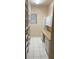 Large pantry with built-in shelves and cabinets, tile floor, and natural light at 3004 Darby Falls Dr, Las Vegas, NV 89134