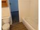 The bathroom features a shower/tub combo and toilet with access to an adjacent carpeted room at 311 Manti Pl # 311, Henderson, NV 89014