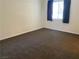 Bedroom features neutral carpeting, window with curtains, and neutral wall color at 311 Manti Pl # 311, Henderson, NV 89014