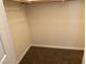 A standard closet features neutral carpeting and a closet rod for optimal storage at 311 Manti Pl # 311, Henderson, NV 89014