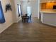 Cozy dining area with wood-style flooring, seamlessly connected to the kitchen at 311 Manti Pl # 311, Henderson, NV 89014